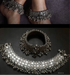 A pair of vintage pure silver anklets with intricate designs