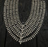 925 silver layered statement necklace with multiple curved rows of metallic spikes and teardrop charms