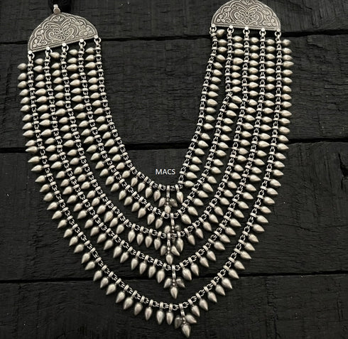 An antique 925 silver multi-strand necklace with intricate dangling teardrop or paisley beads