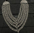 An antique 925 silver multi-strand necklace with intricate dangling teardrop or paisley beads