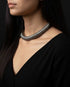Close-up of a person wearing a 925 silver sutlada necklace