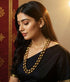 Woman wearing gold plated pure silver dholki beads necklace from macs jewelry