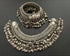 A pair of vintage pure silver anklets with floral patterns and multiple layers of ghungaroo design