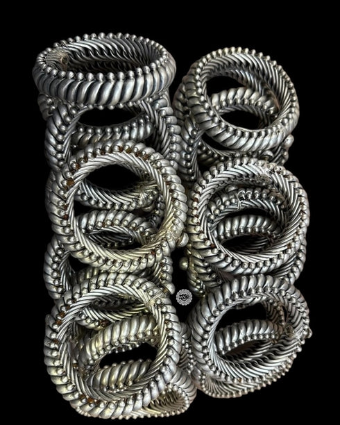 925 pure silver sutlada kada with a flexible design, showing multiple kadas arranged from macs jewelry