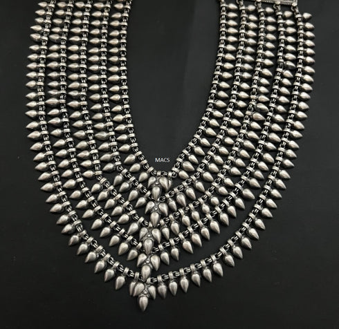 A multi strand 925 silver statement necklace with textured metallic spikes and geometric links