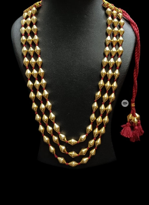 Traditional three line Gold dholki beads necklace with red tassel for weddings