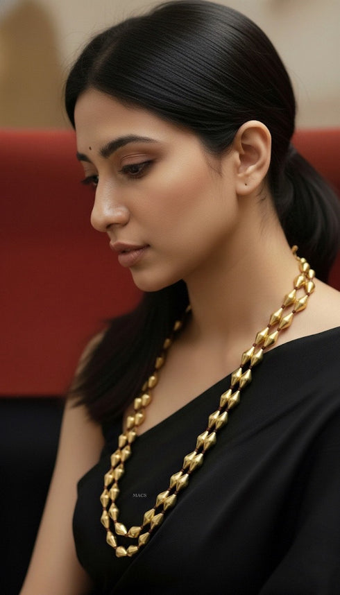 Woman wearing a bollywood layered dholki necklace from macs jewelry